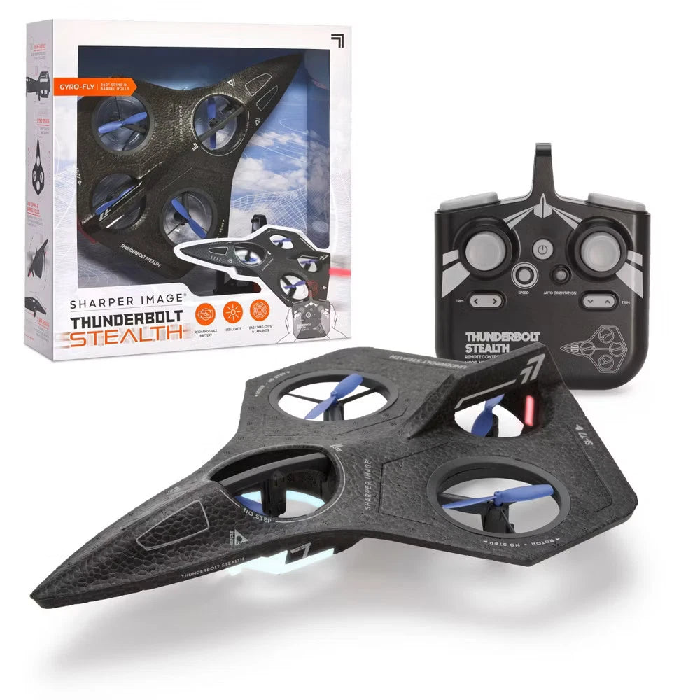 A black stealth-style quadcopter drone with blue propellers, shown in front of its retail box and a black remote control on a white background.